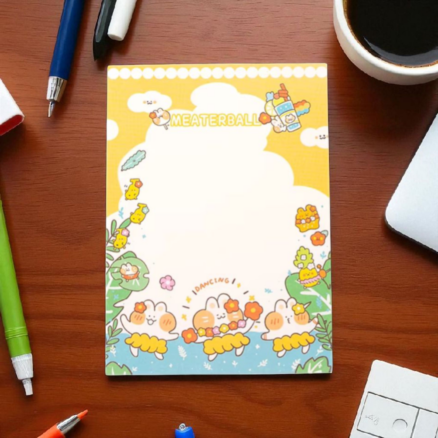 Colorful cute notepad featuring playful animal characters, designed for cheerful notes and reminders, on a wooden desk.