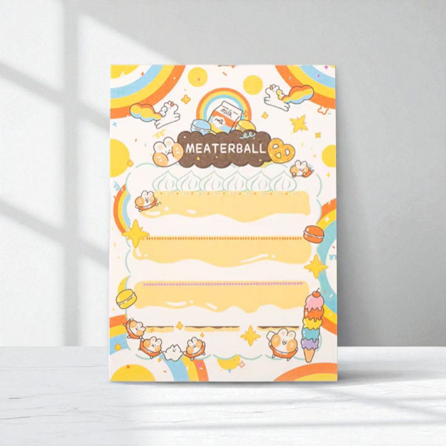 Colorful 'Meaterball' notepad featuring cute characters, rainbow accents, and decorative borders for joyful note-taking.