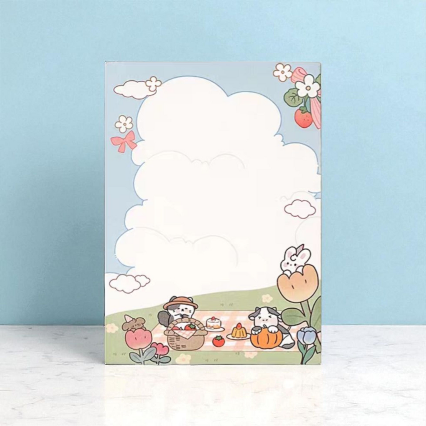 Cute A6 notepad design featuring animals, flowers, and a cloudy sky, ideal for notes and messages.